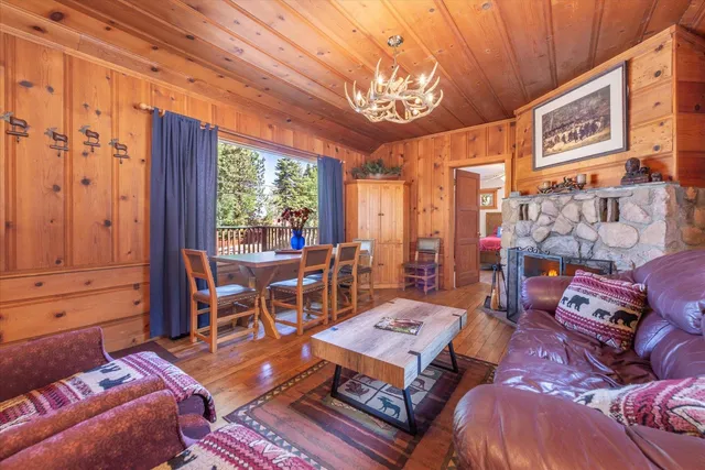 a living room with lots of furniture and a large window