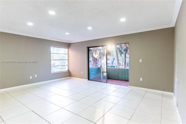 a view of a big room with windows and cabinet