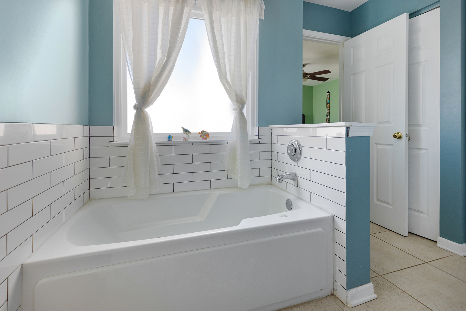 1 Carl Court Lake In The Hills, IL 60156 - Photo 13 of 20 a bathroom with bathtub and window