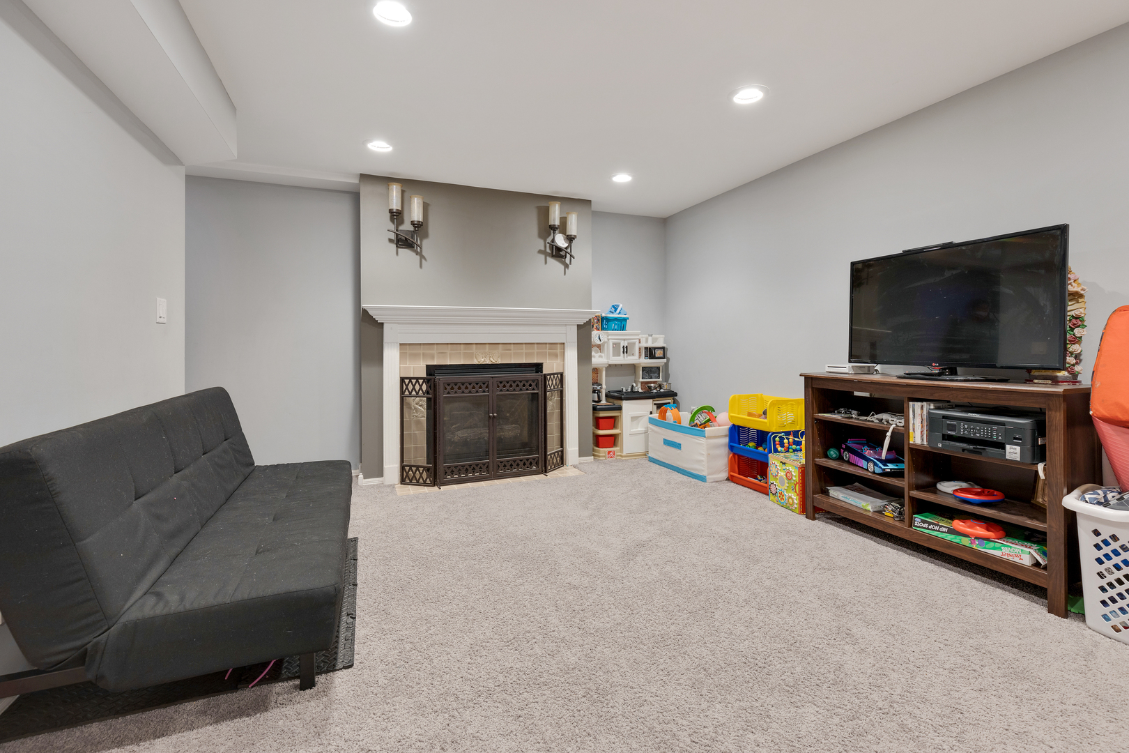 1 Carl Court Lake In The Hills, IL 60156 - Photo 17 of 20 a living room with furniture and a flat screen tv