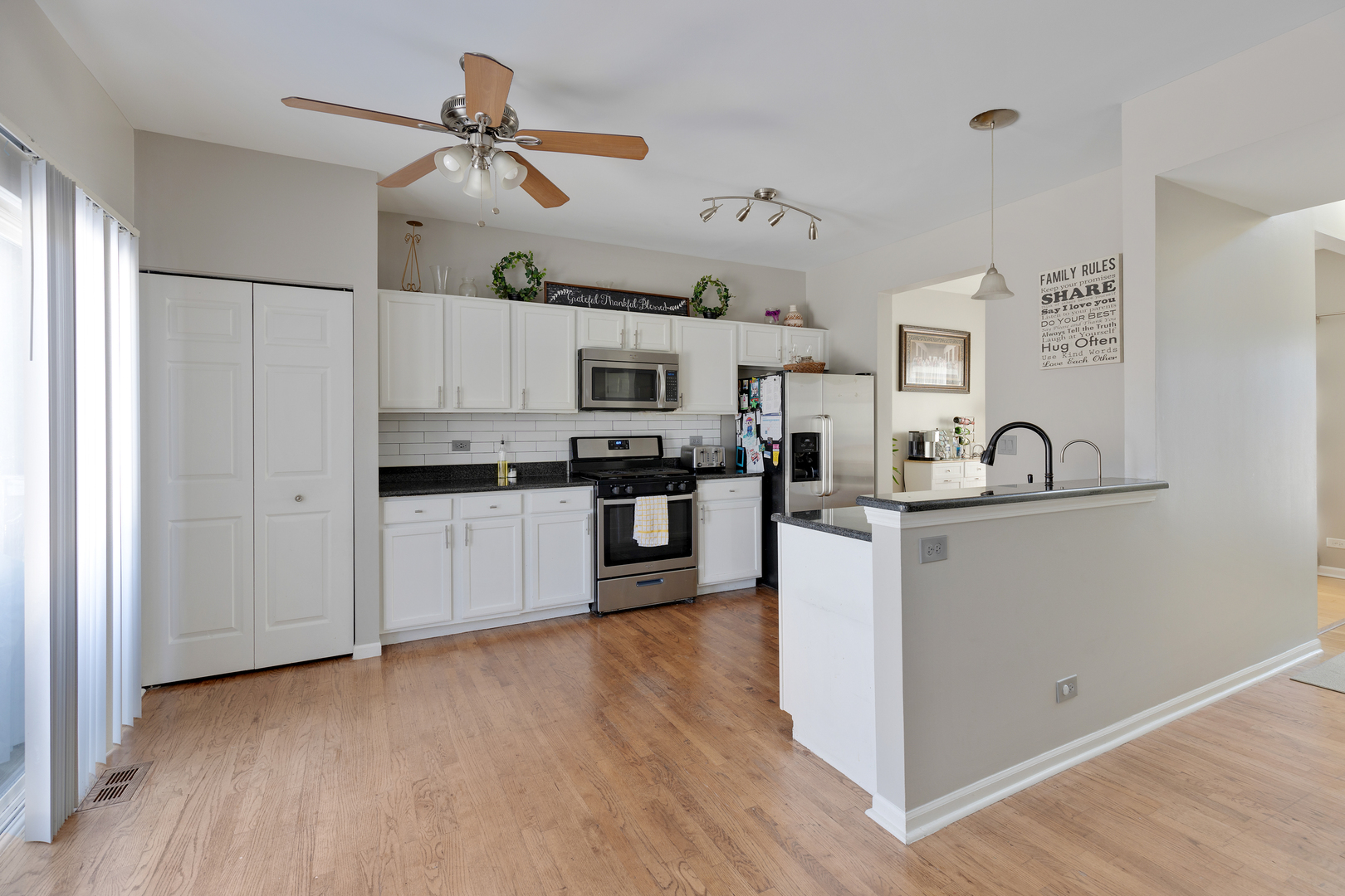 1 Carl Court Lake In The Hills, IL 60156 - Photo 6 of 20 a kitchen with cabinets a sink and stainless steel appliances