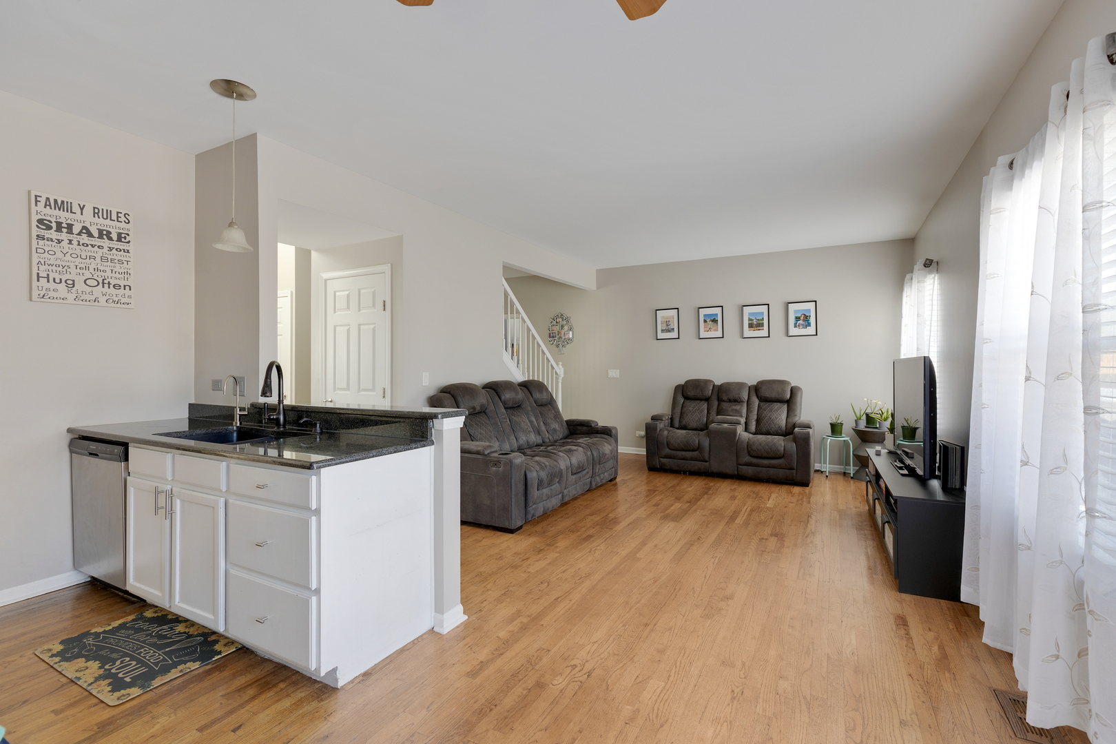 1 Carl Court Lake In The Hills, IL 60156 - Photo 7 of 20 a kitchen with sink cabinets and wooden floor