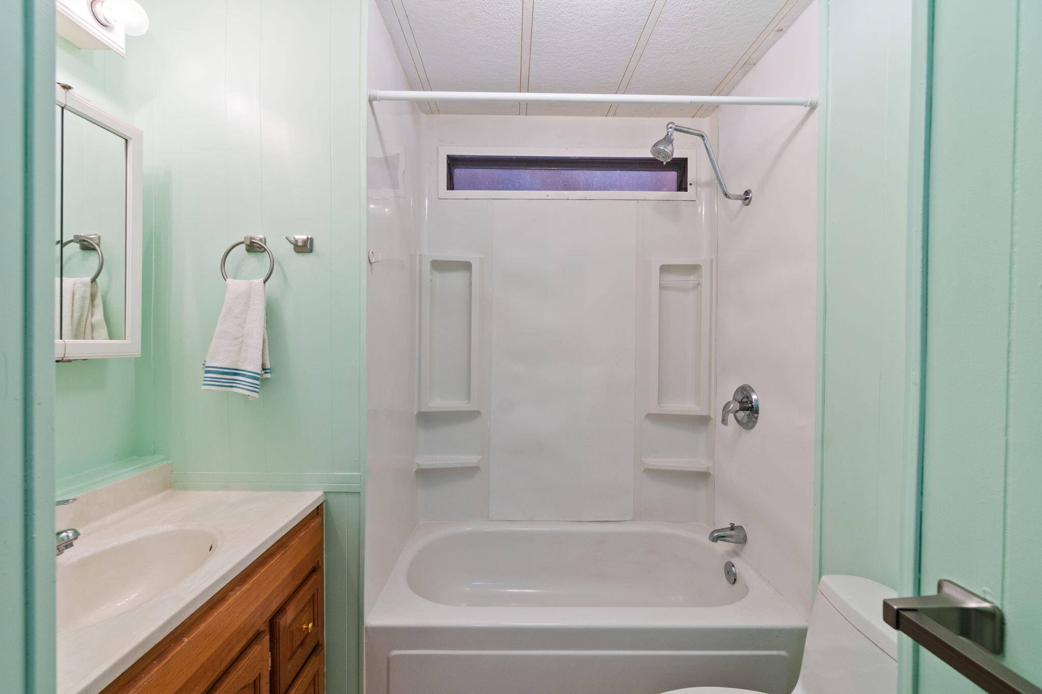 7517 Brett Road Shingletown, CA 96088 - Photo 9 of 26 a bathroom with a tub sink and vanity