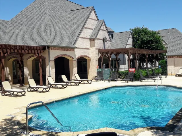 a view of a kitchen with a stove and cabinets