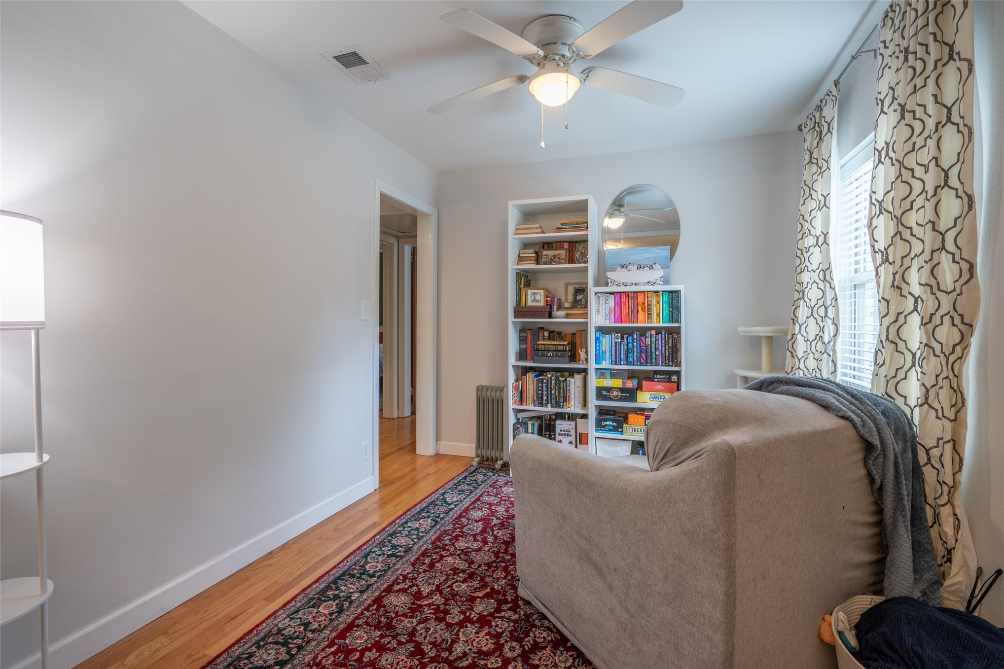 807 Stanley Drive Fernandina Beach, FL 32034 - Photo 14 of 30 a living room with furniture and a bookshelf