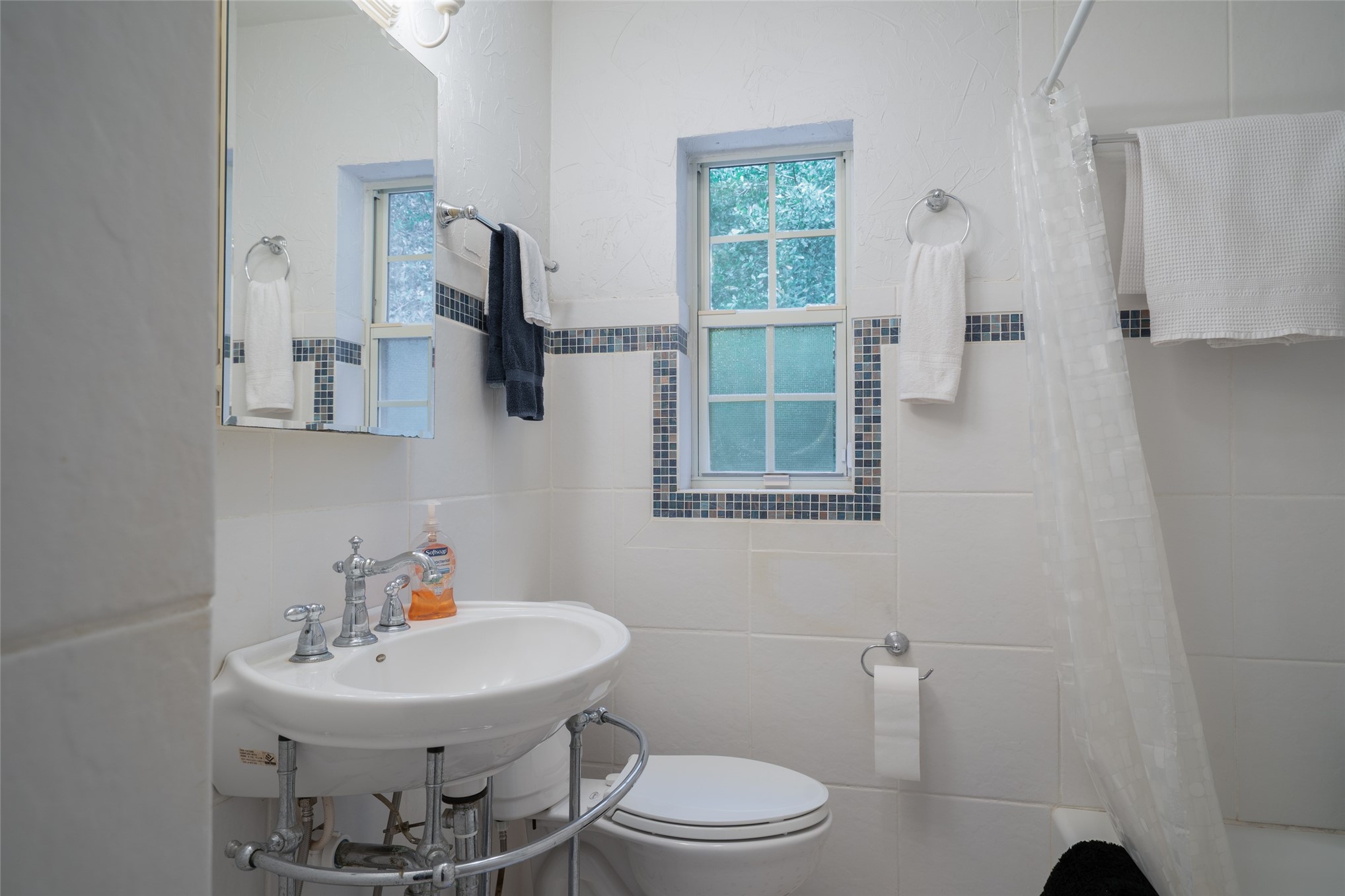 807 Stanley Drive Fernandina Beach, FL 32034 - Photo 22 of 30 a bathroom with a toilet a sink and mirror