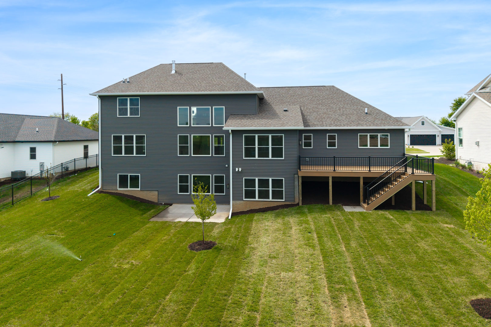 6928 Wilderness Pointe Bettendorf, IA 52722 - Photo 4 of 48 a view of a house with a swimming pool