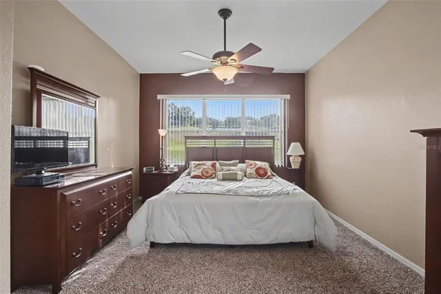 a bedroom with a bed and window