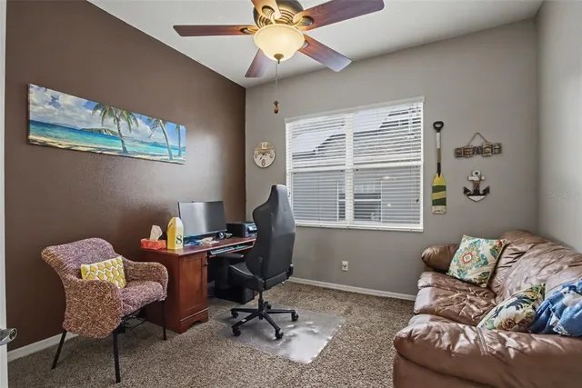 a work room with furniture and windows