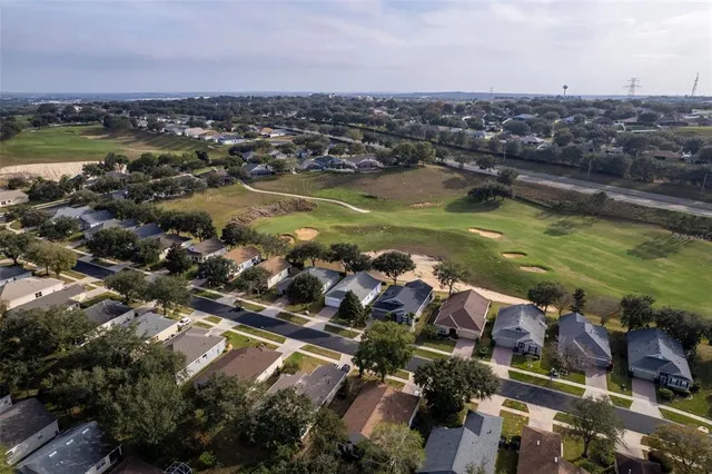 an aerial view of a houses with a lake view
