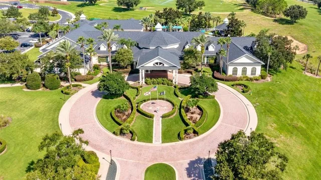 an aerial view of a house with a swimming pool