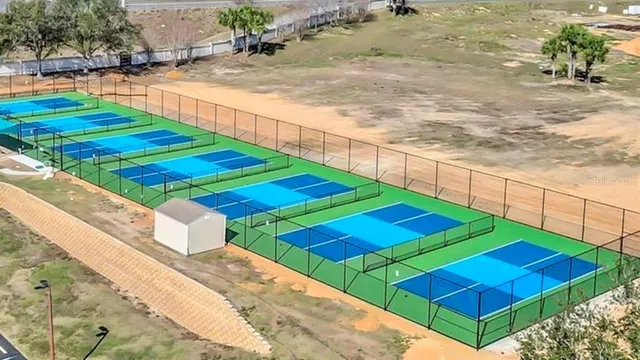 a view of a swimming pool with outdoor seating