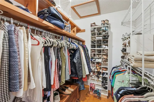 a bathroom with a granite countertop sink mirror and toilet