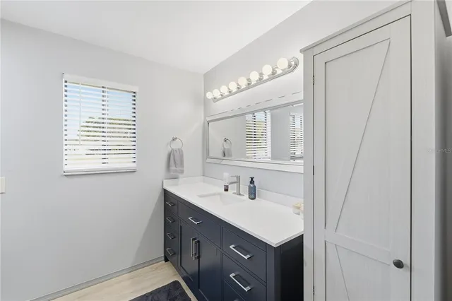 a bathroom with a toilet and a shower curtain