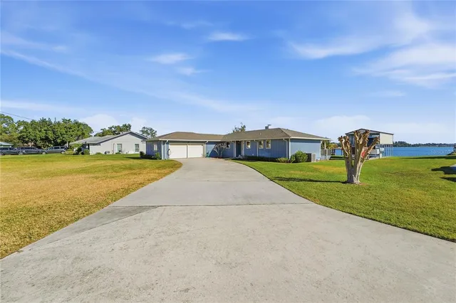 a view of a lake with couches and city view