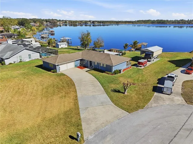 an aerial view of a house with swimming pool