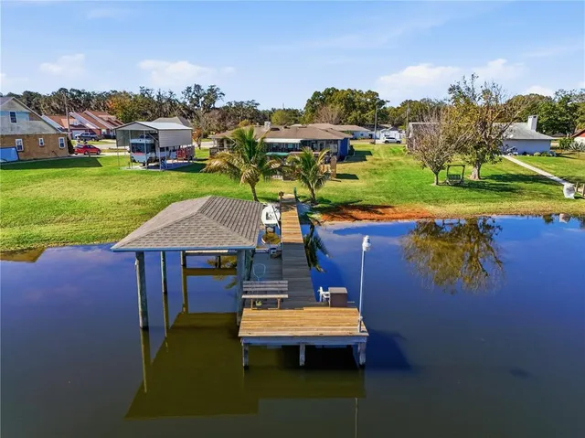 an aerial view of a houses with outdoor space