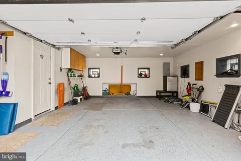 a view of a livingroom with furniture and a flat screen tv