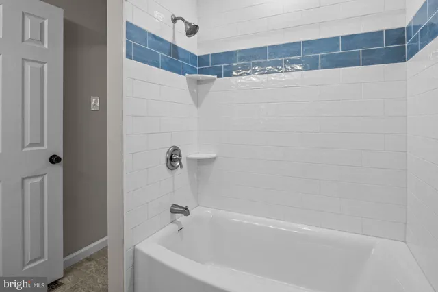 a bathroom with a shower and a bathtub