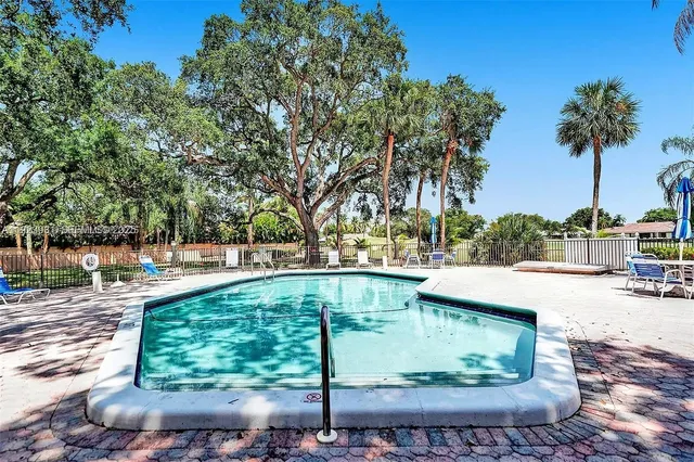 a view of swimming pool with a patio