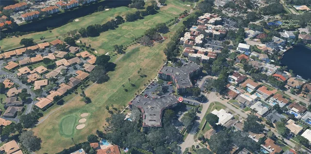 an aerial view of a residential houses with outdoor space