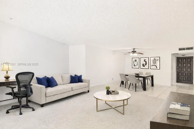 a living room with furniture and a rug