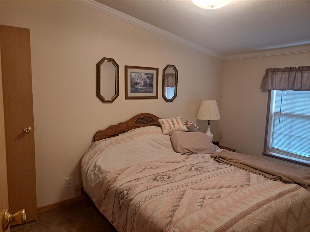 844 Williams Street Confluence, PA 15424 - Photo 11 of 13 a bedroom with a bed and painting on the wall