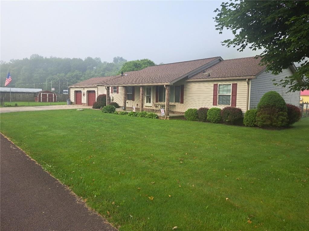 844 Williams Street Confluence, PA 15424 - Photo 2 of 13 a front view of a house with a garden