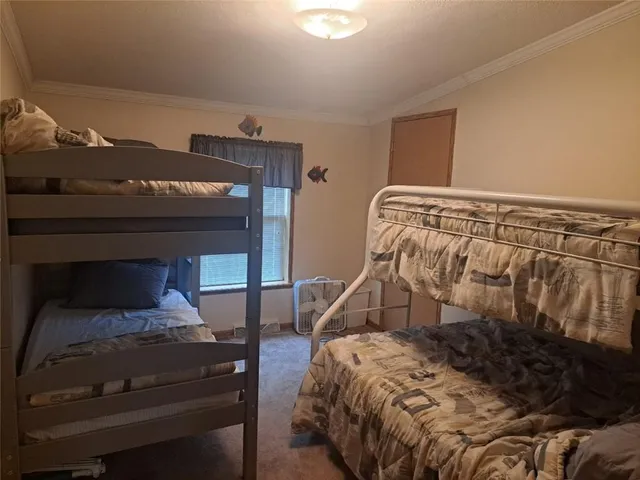 a bedroom with a bed and a mirror