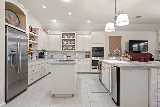 a bathroom with a sink a vanity and a mirror