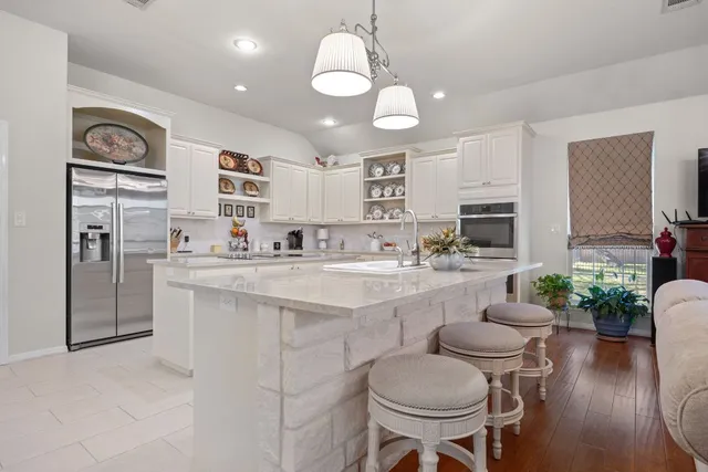 a living room with furniture lamp and a window