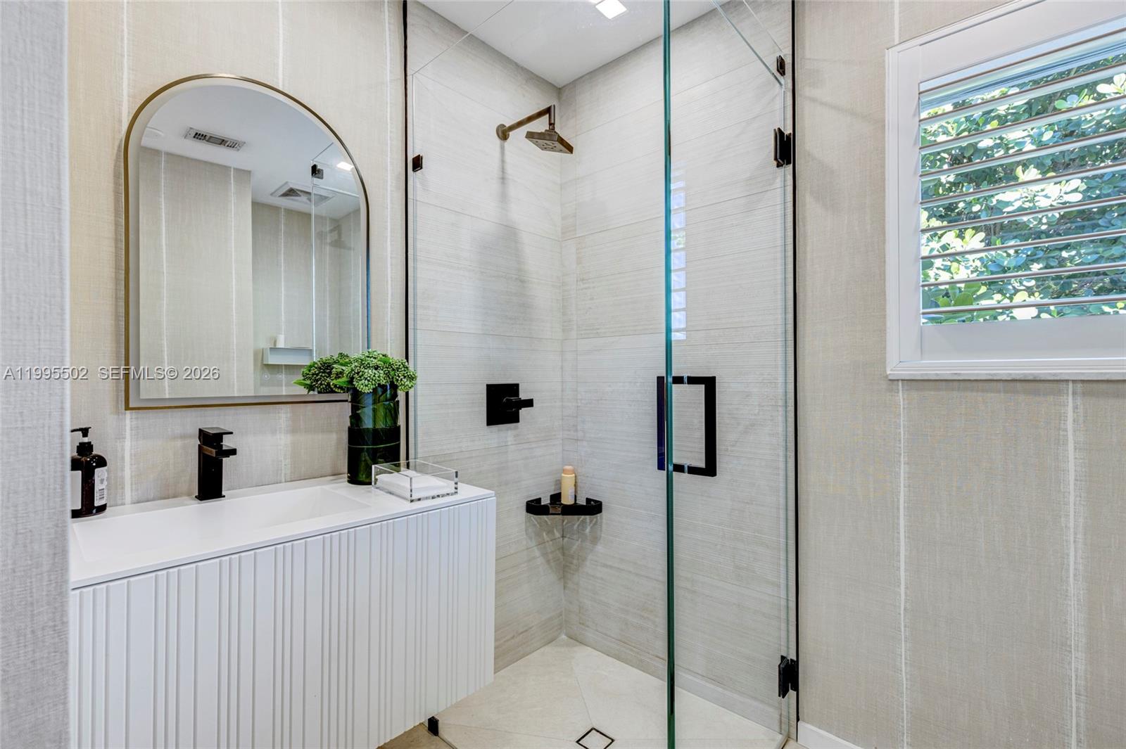 6449 Southwest 56th Street South Miami, FL 33155 - Photo 16 of 39 a bathroom with a sink and a mirror