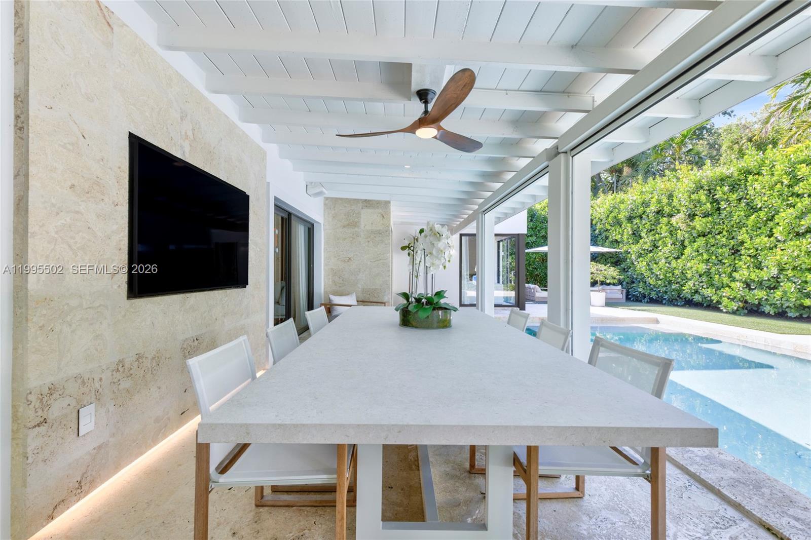 6449 Southwest 56th Street South Miami, FL 33155 - Photo 20 of 39 a view of a dining room with furniture window and wooden floor