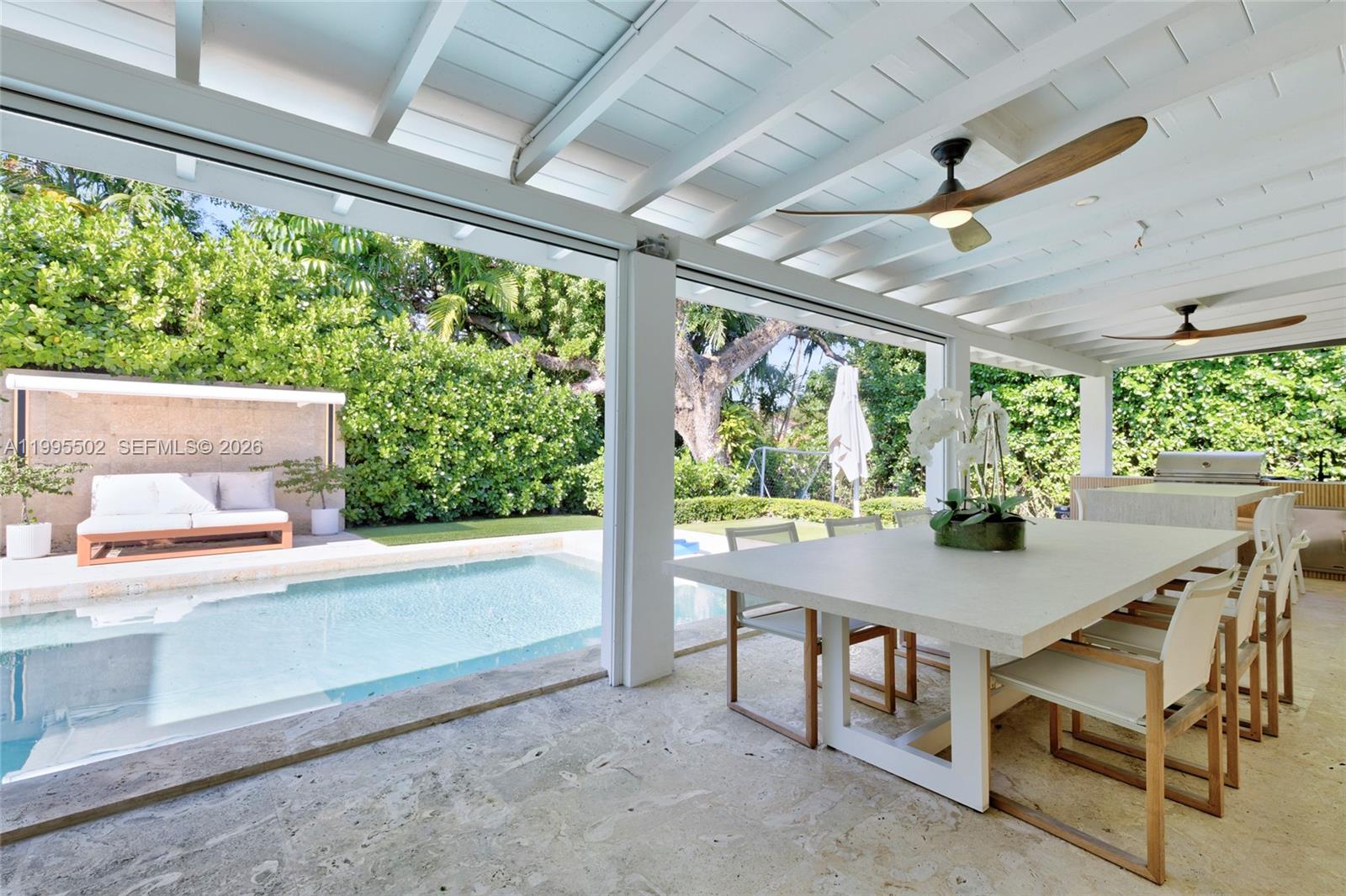 6449 Southwest 56th Street South Miami, FL 33155 - Photo 22 of 39 a view of a dining room with furniture window and outside view