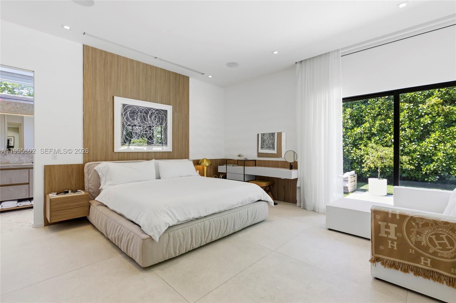 6449 Southwest 56th Street South Miami, FL 33155 - Photo 29 of 39 a spacious bedroom with a bed and a large window