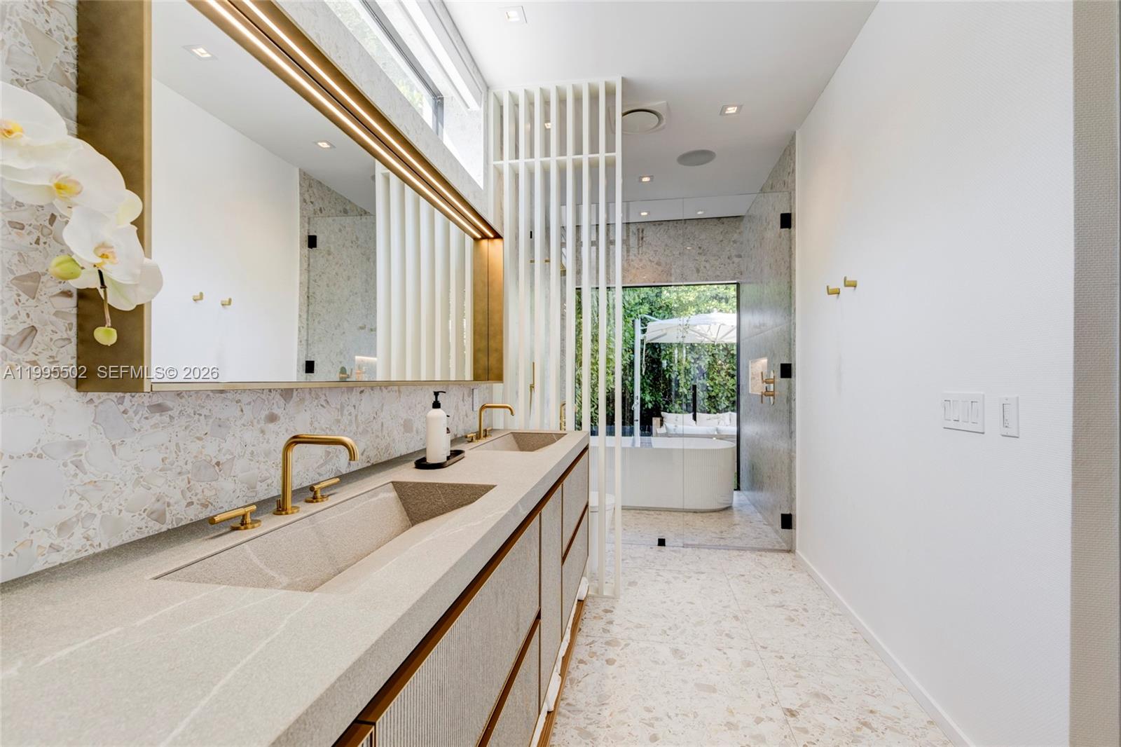 6449 Southwest 56th Street South Miami, FL 33155 - Photo 32 of 39 a bathroom with a sink a vanity and mirror