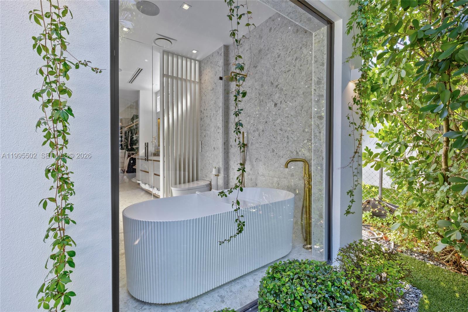 6449 Southwest 56th Street South Miami, FL 33155 - Photo 33 of 39 a bath room with a potted plant and a shower