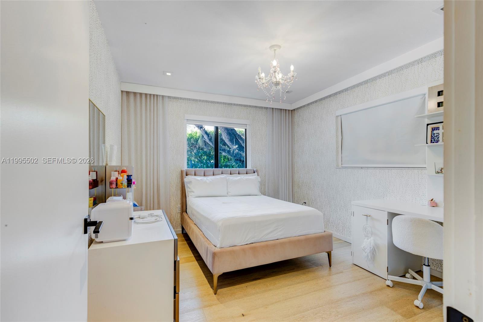 6449 Southwest 56th Street South Miami, FL 33155 - Photo 37 of 39 a bedroom with a bed and a table chair