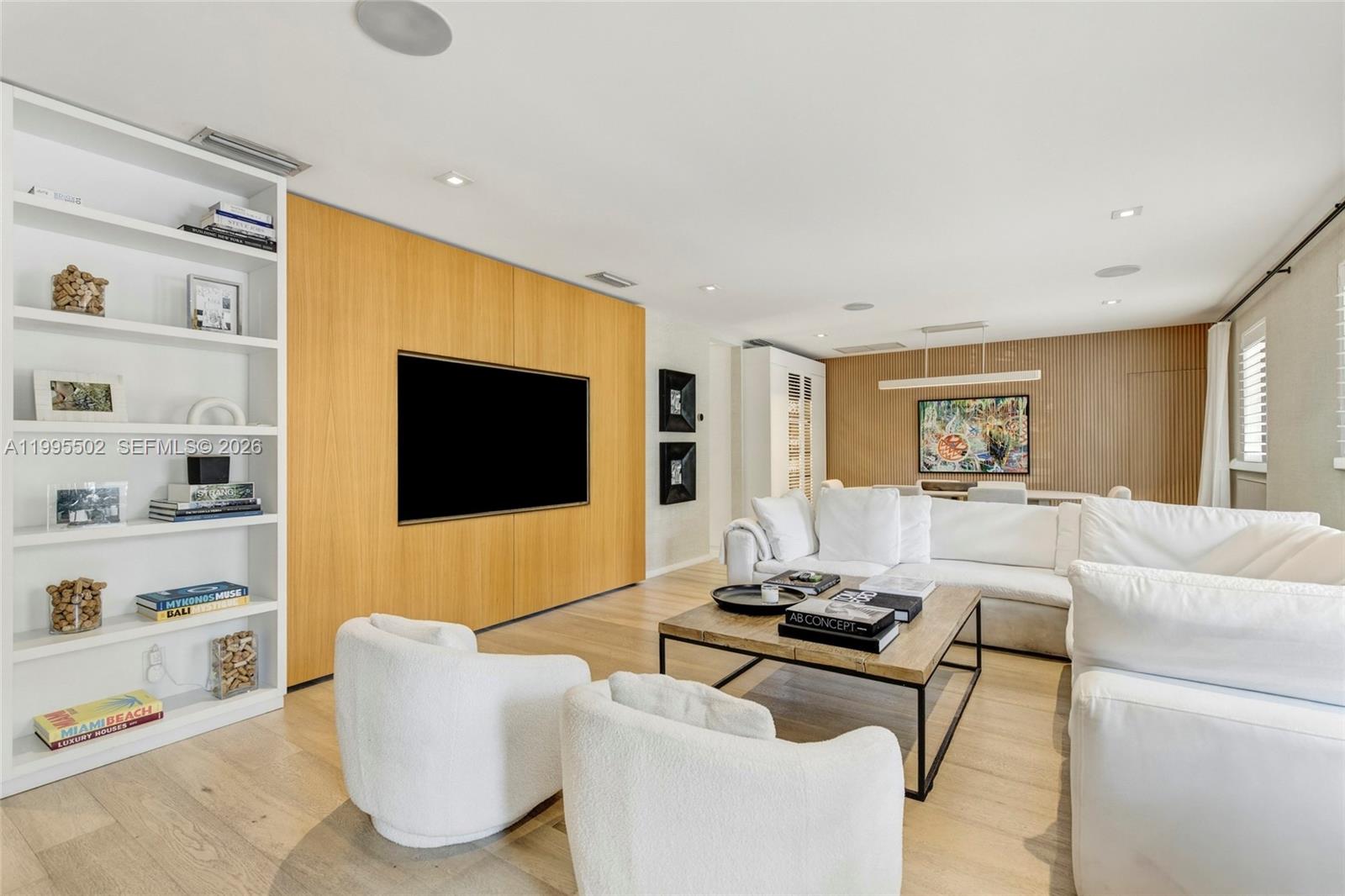 6449 Southwest 56th Street South Miami, FL 33155 - Photo 5 of 39 a living room with furniture and a flat screen tv