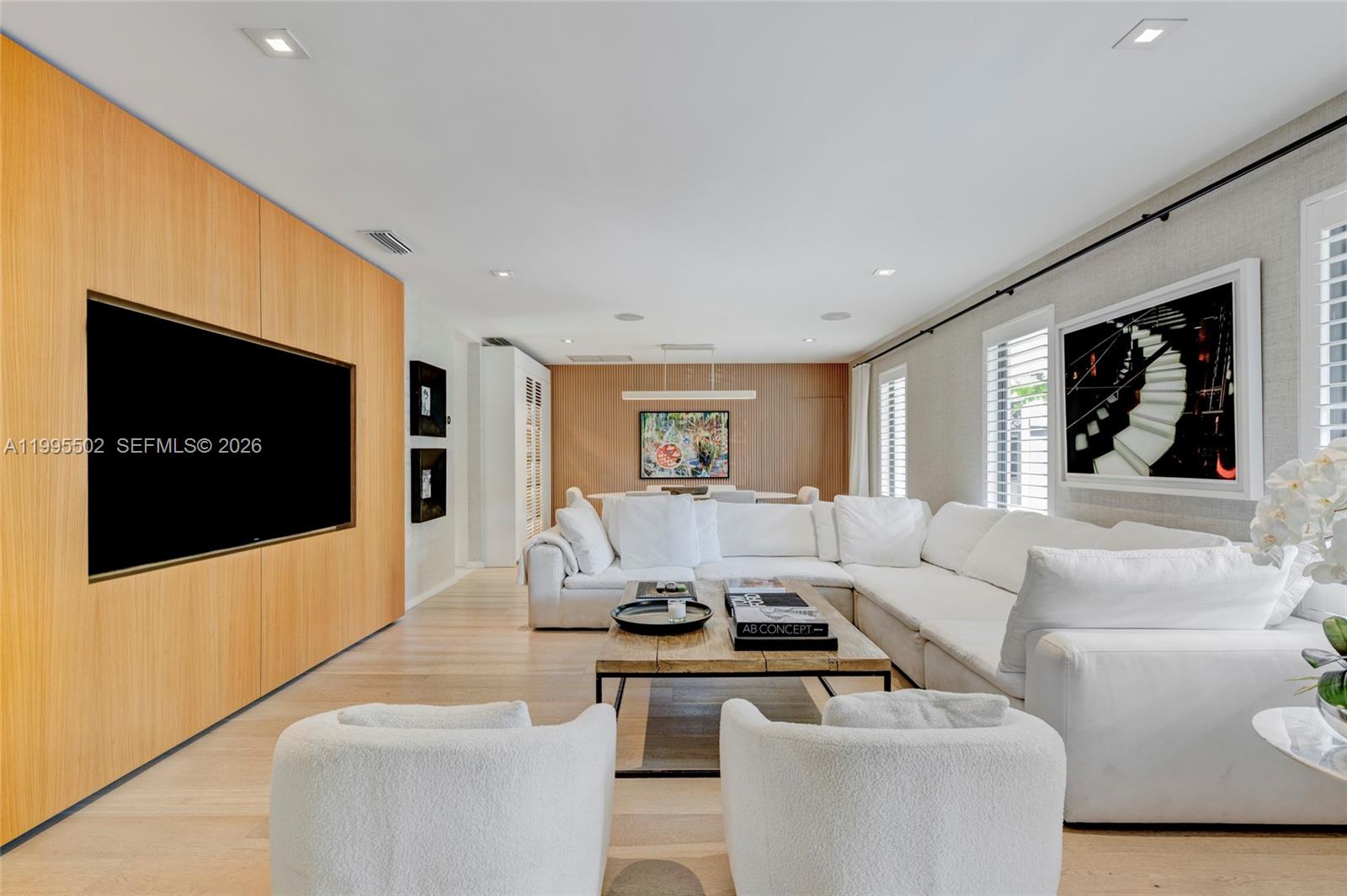 6449 Southwest 56th Street South Miami, FL 33155 - Photo 6 of 39 a living room with furniture and a flat screen tv