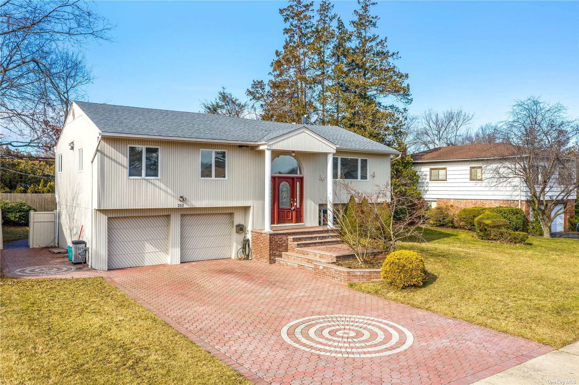 352 Elm Drive Roslyn, NY 11576 - Photo 1 of 1 a view of a house with a swimming pool and sitting area