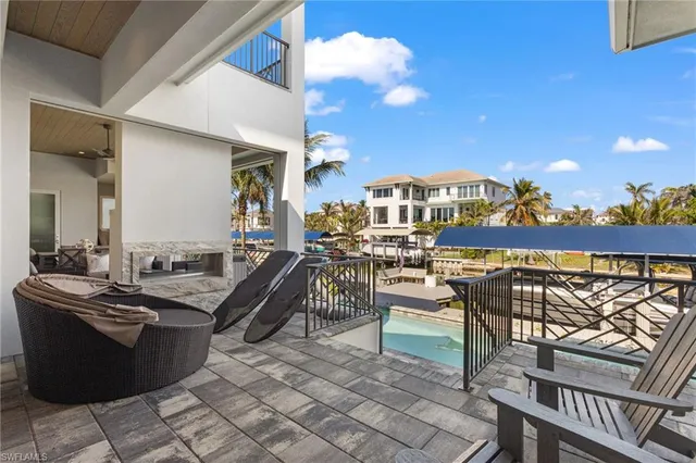 a view of a patio with chairs and tables