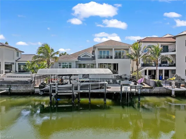 a view of house with swimming pool yard and outdoor seating