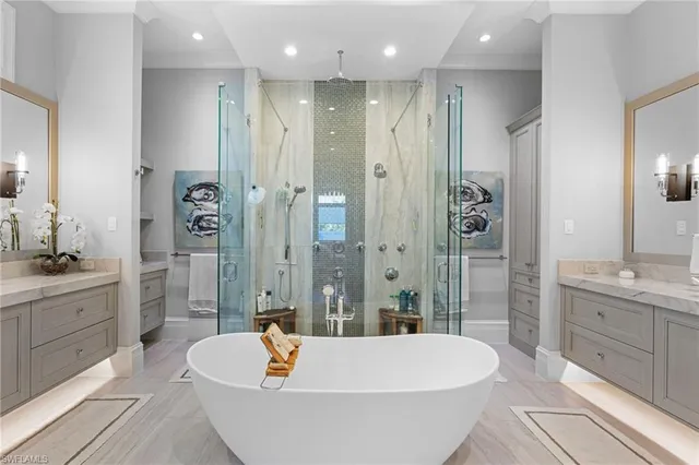 a bathroom with a granite countertop tub sink and shower