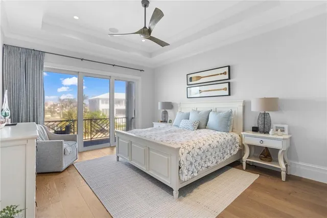 a spacious bedroom with a bed and a large window