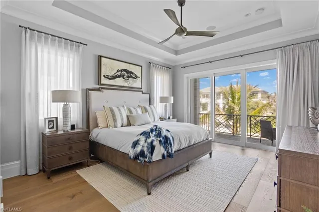 a spacious bedroom with a large bed and a large window