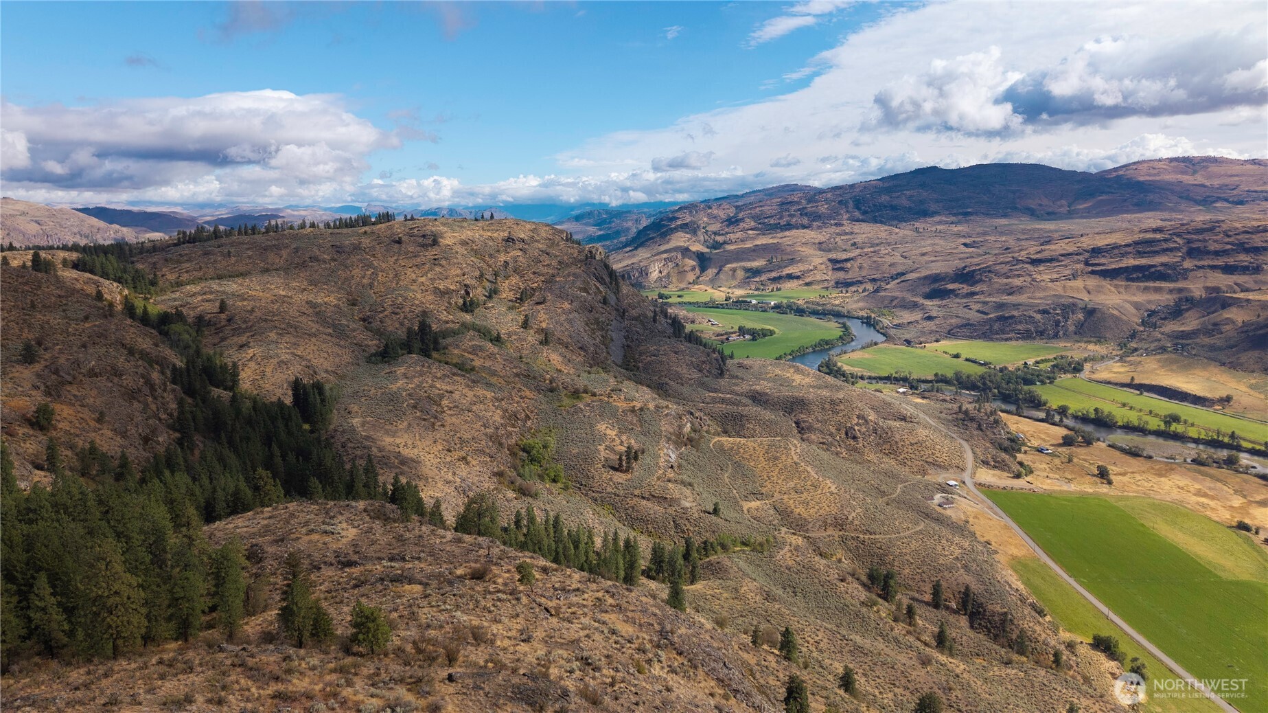 0 Tbd Pharr Out - 15 Way Riverside, WA 98849 - Photo 5 of 9 a view of a city with mountains in the background