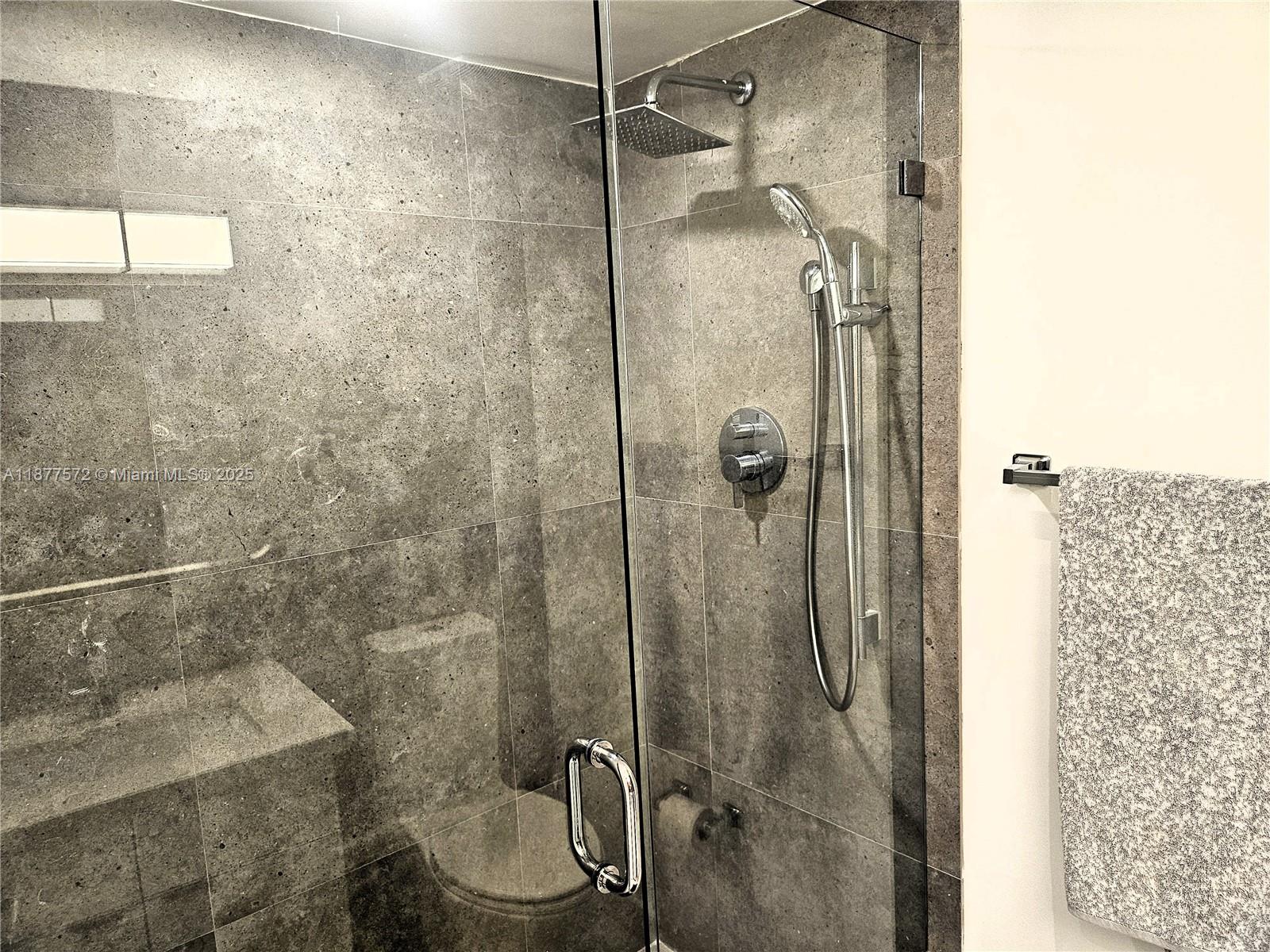 5161 Collins Avenue, Unit 707 Miami Beach, FL 33140 - Photo 15 of 69 a bathroom with a shower