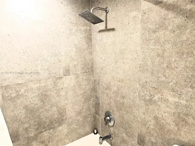 a bathroom with a sink mirror and toilet