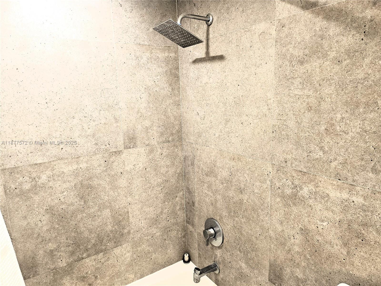 5161 Collins Avenue, Unit 707 Miami Beach, FL 33140 - Photo 18 of 69 a bathroom with a shower